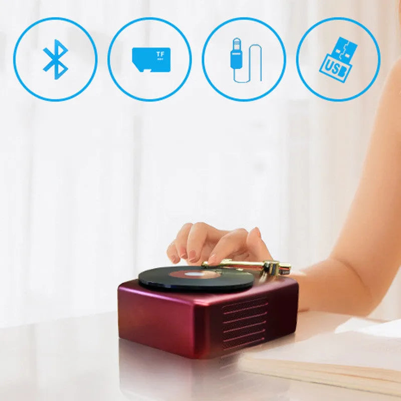 T12 record player with Bluetooth 5.0 in black, showing top view with vinyl record on platter and control buttons