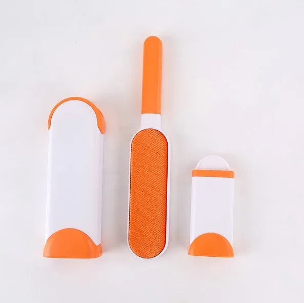 Blue reusable pet hair removal comb with double-sided sticky brush next to its self-cleaning base.