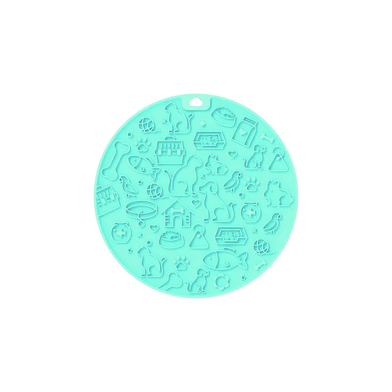 Round silicone pet licking mat with textured surface and a central suction cup, shown in mint green colour.