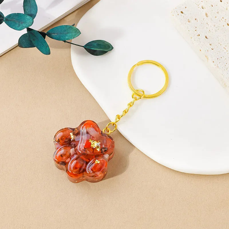 Natural crystal cat's paw keychain pendant in a chosen gemstone like turquoise or amethyst.
