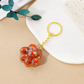 Natural crystal cat's paw keychain pendant in a chosen gemstone like turquoise or amethyst.