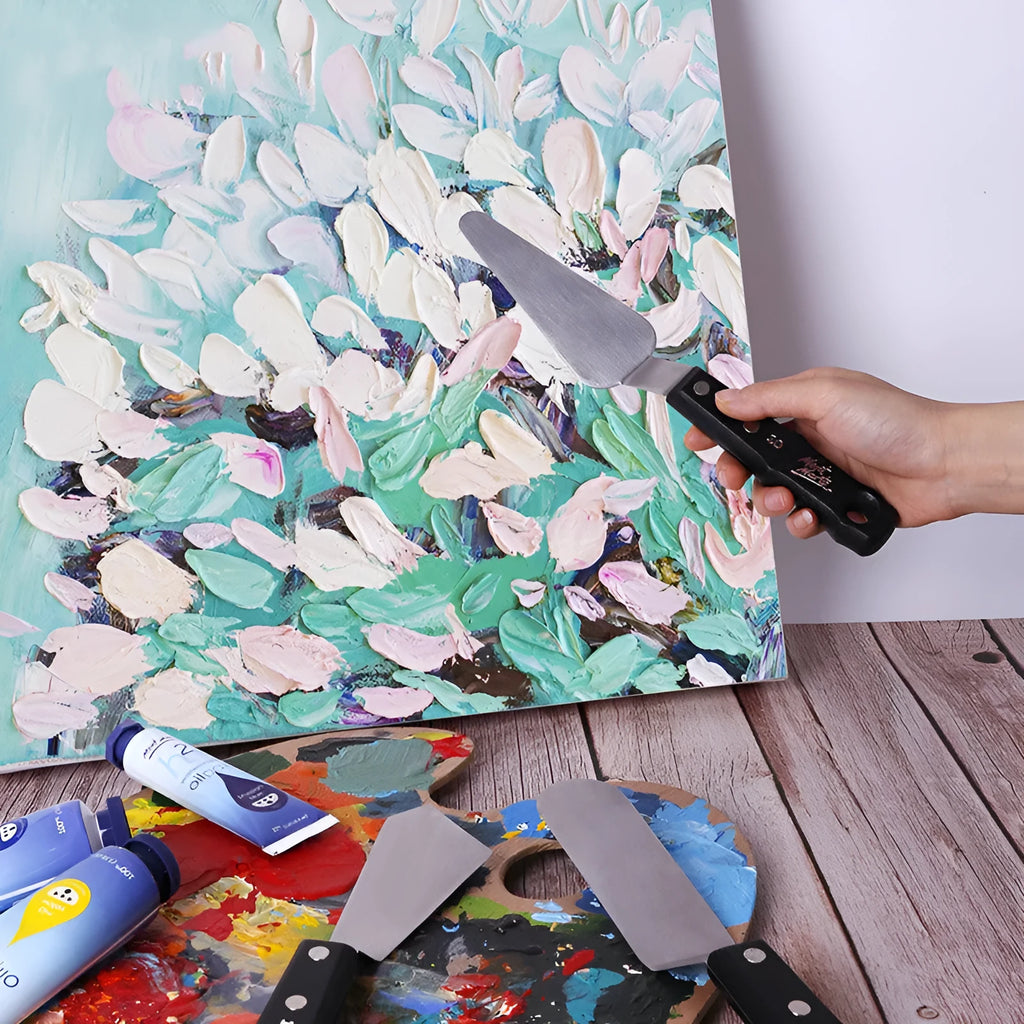 Three stainless steel oil painting scrapers showing No. 3, No. 10, and No. 12 palette knives