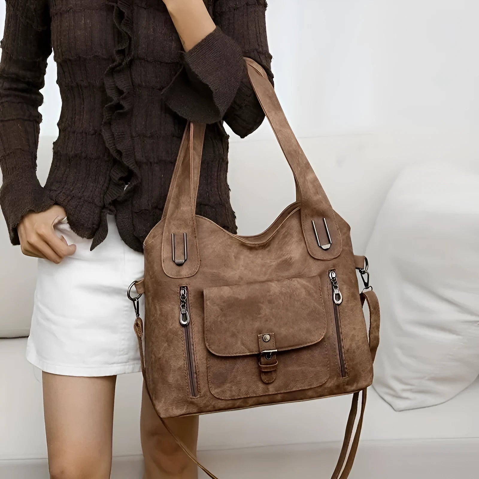 Soft synthetic leather handbag with metal accent in vintage style, colour example shown