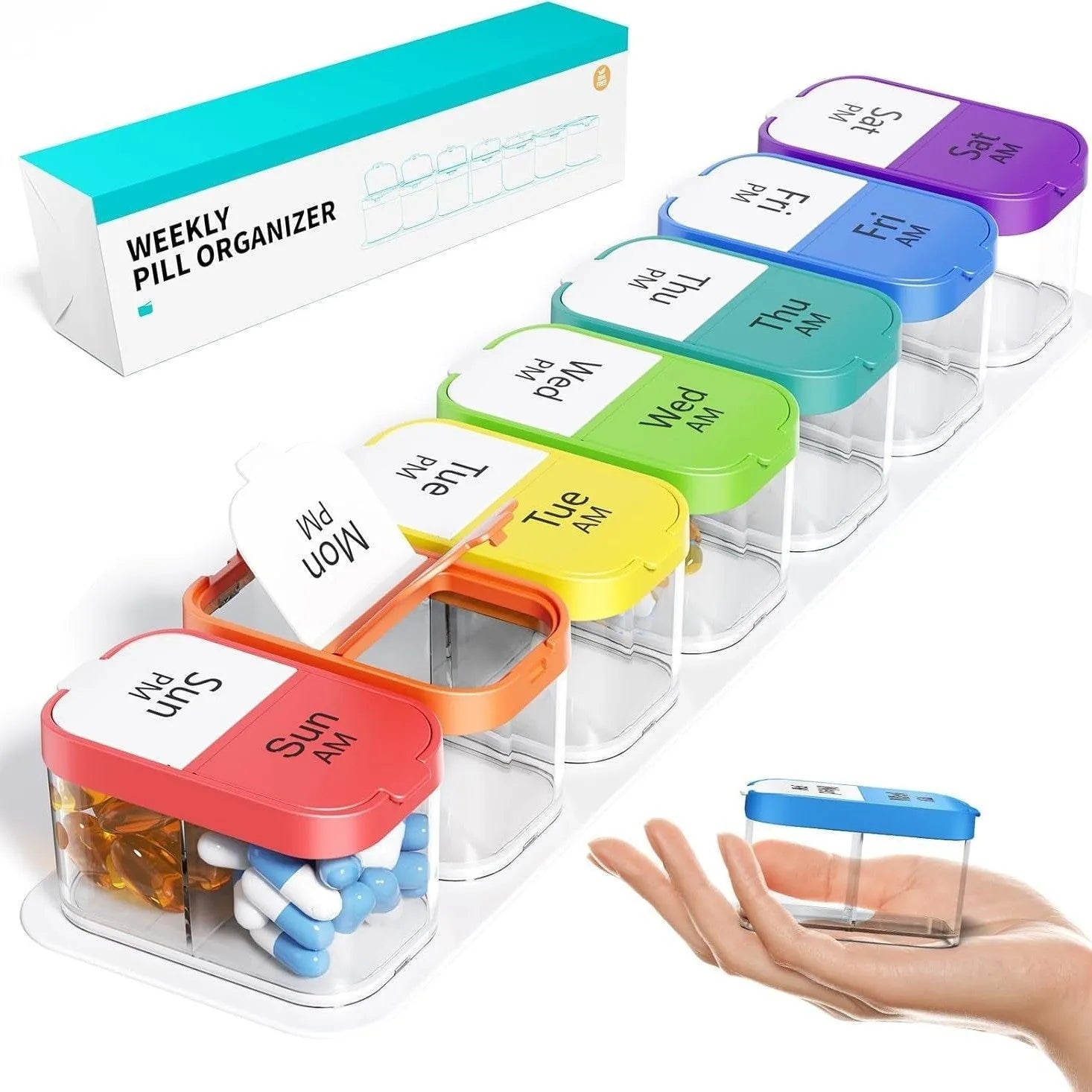 Large white and rainbow coloured plastic pill box with 14 removable compartments open on a table.