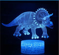 Colourful dinosaur 3D night light with acrylic plate on ABS base, showing remote control.