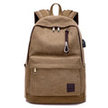 Canvas backpack with USB charging port and multiple compartments including separate laptop pocket