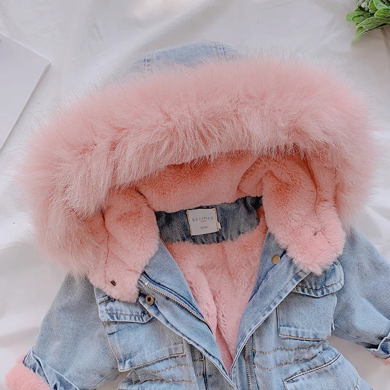 Blue girls' denim coat with a non-removable hood and fleece lining, shown on a hanger.