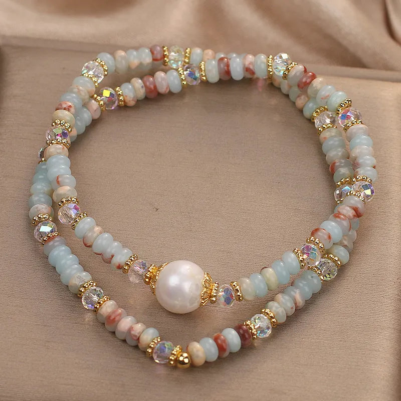 Natural colour Shoushan stone double circle bracelet with crystal one pearl on white background