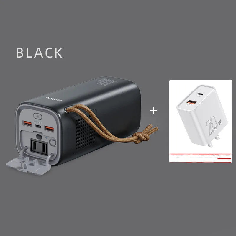 Black portable power bank with solar panel, showing size scale and output ports.