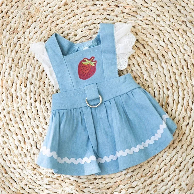 Bondi Blue dog skirt with strawberry and denim print on a small dog model.