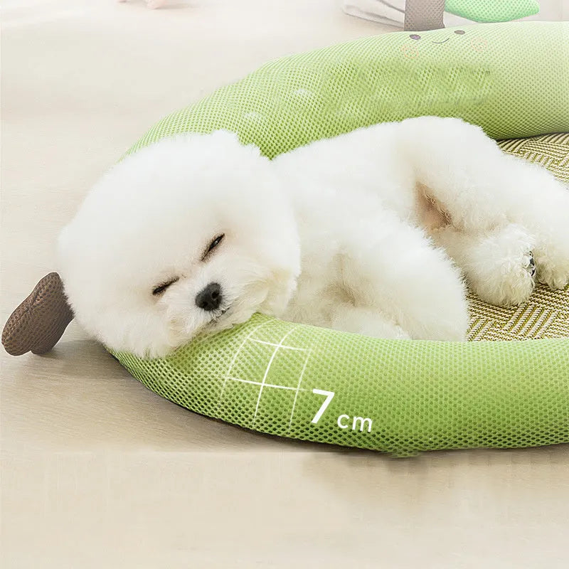 Green pet cooling mat with raised backrest nest for a dog or cat.