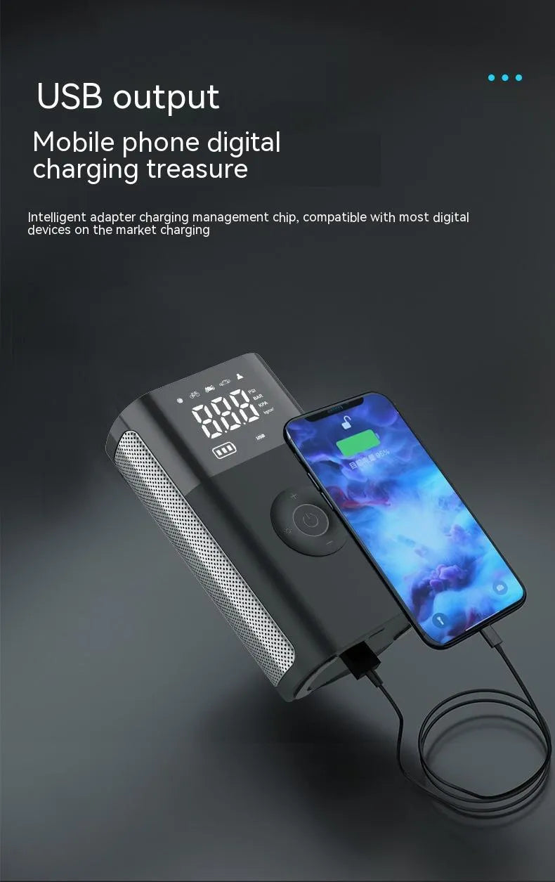 Black handheld wireless digital tyre inflator with LCD screen, LED light and multiple nozzle attachments on a table.