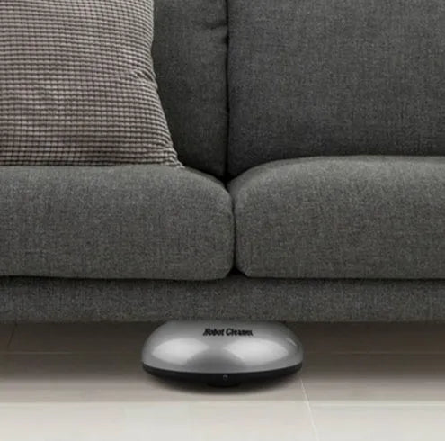 Silver automatic floor sweeping machine with compact design for household cleaning