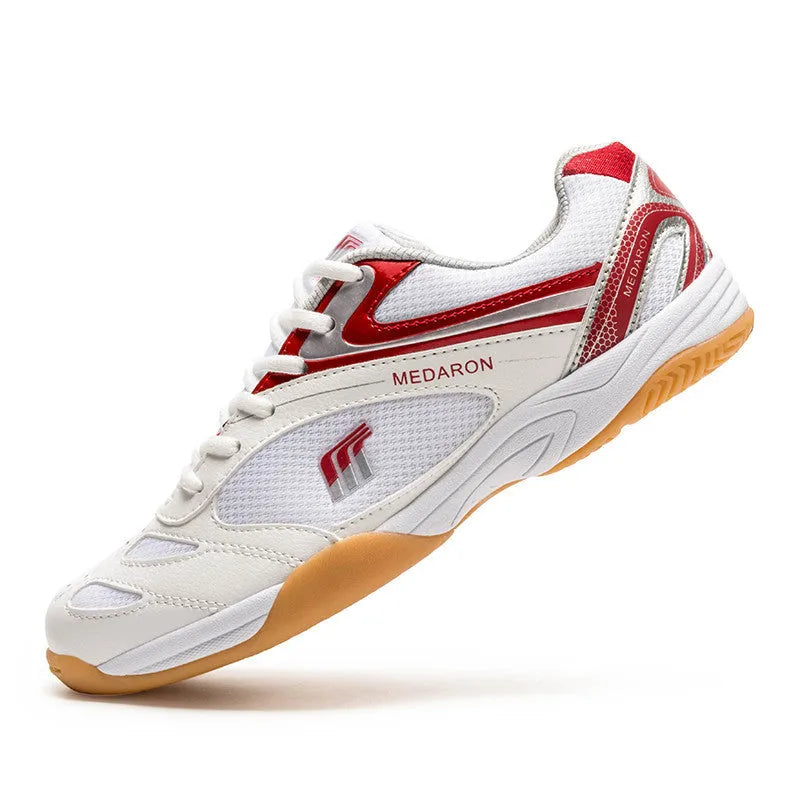 White and red table tennis sneakers with lace-up front and rubber sole.
