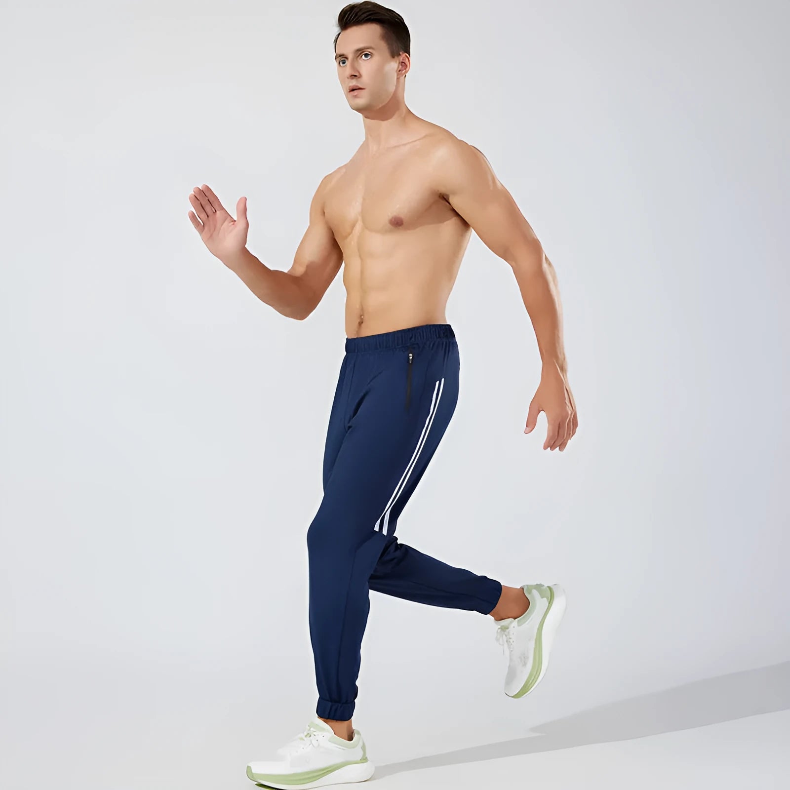 Men's black polyester running trousers with mid-waist, shown flat.