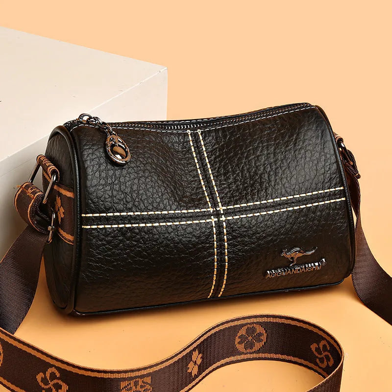Genuine leather women's cylindrical shoulder bag with stitched patchwork, zip pocket, phone pocket and document pocket