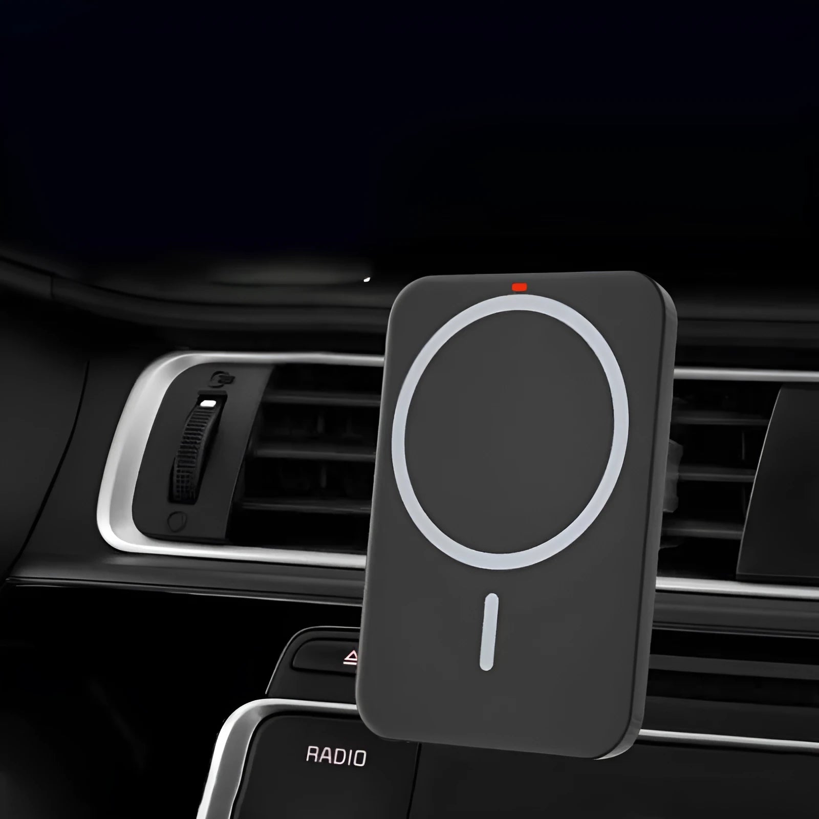 Black car magnetic wireless charger bracket mounted on car vent with phone attached