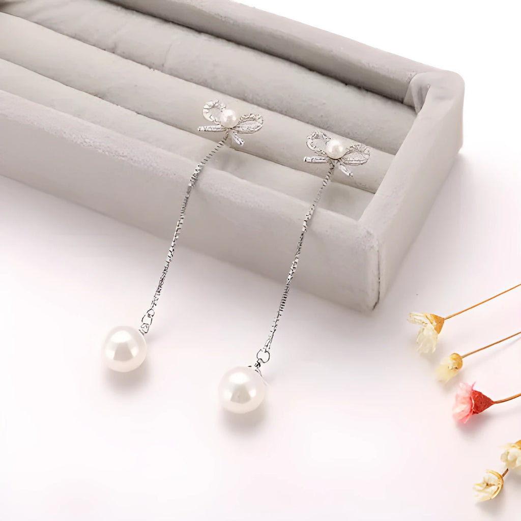 Sterling silver bow earrings with long pearl pendant, hypoallergenic copper construction, women's two-way style