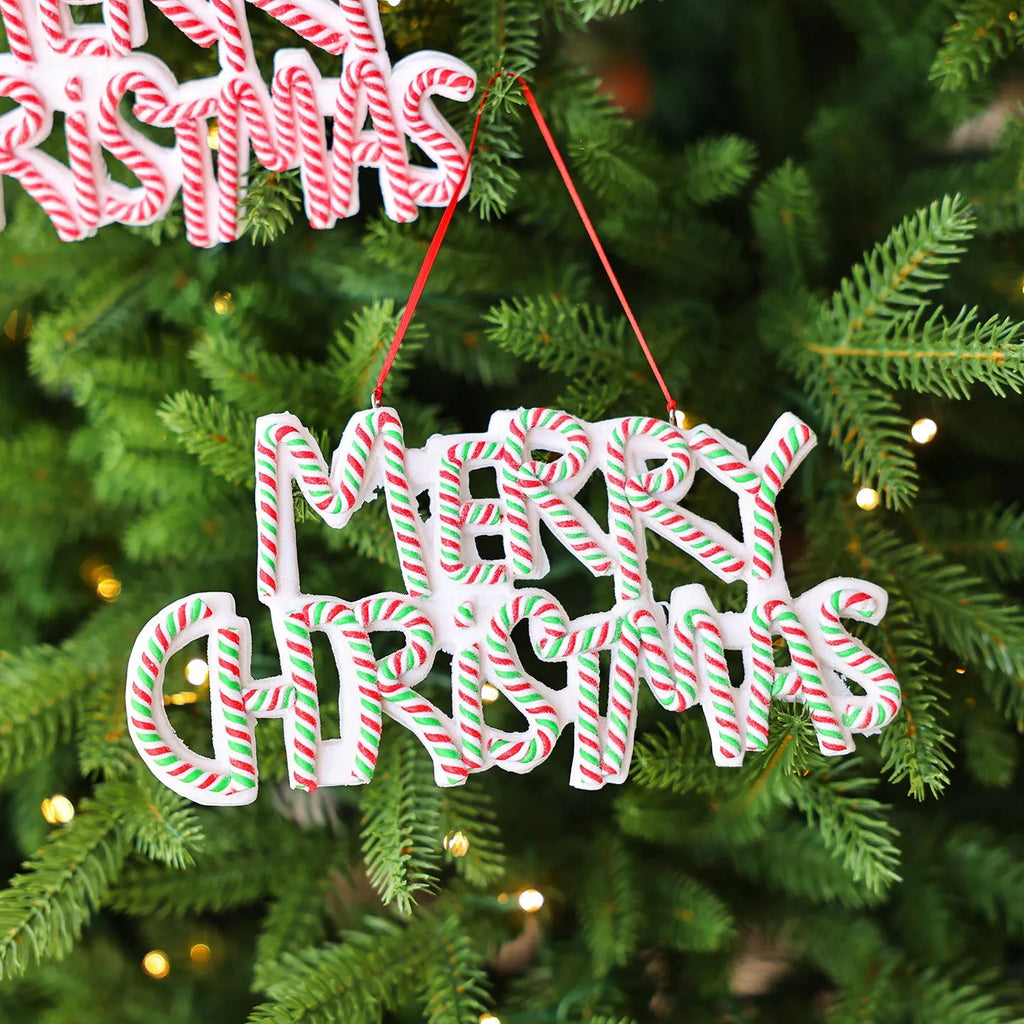 Merry Christmas letter plate polymer clay ornament in red and white hanging on Christmas tree branch