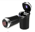 Black and silver car ashtray with blue LED light lid and stainless steel cigarette slot in a cup holder