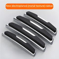 Four black plastic silicone car door protector strips measuring 9.5cm by 2cm