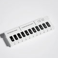 Black and white plastic piano-shaped temporary parking sign for car space marking
