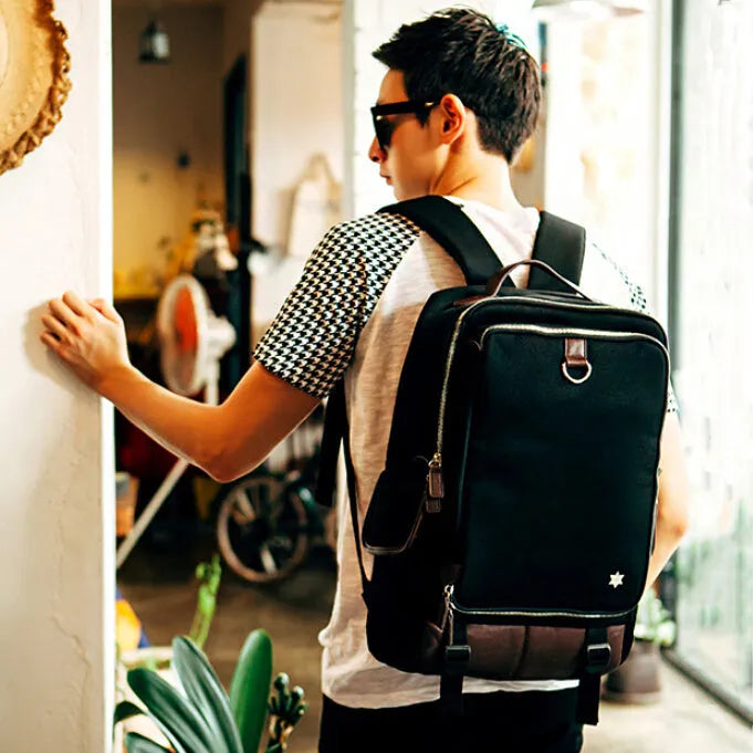 Modern men's large backpack in Oxford cloth, shown in army green colour, with dimensions 30cm by 16cm by 46cm.