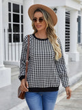 Black long sleeve polyester sweater with a plaid pattern, shown on a hanger.