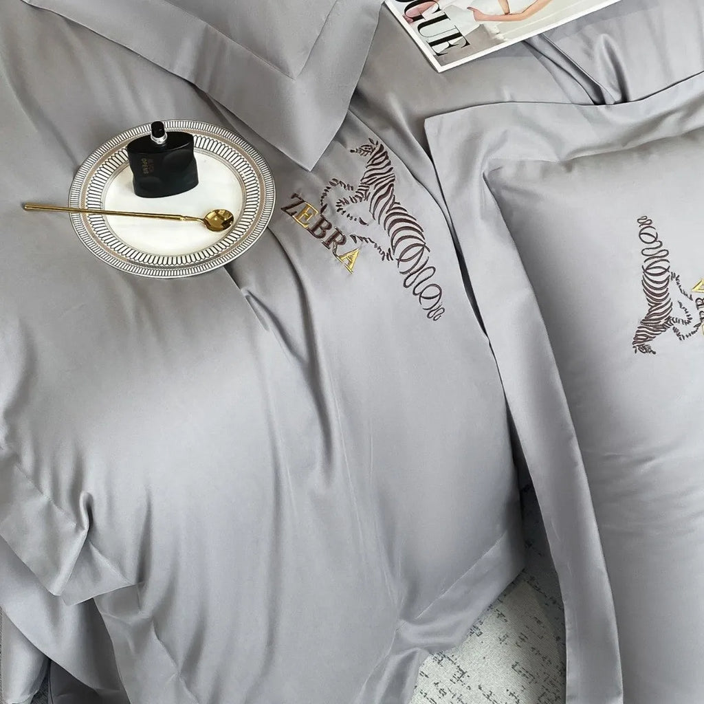 Solid colour pure cotton four-piece bedding set with light brushed finish on a bed in a modern bedroom
