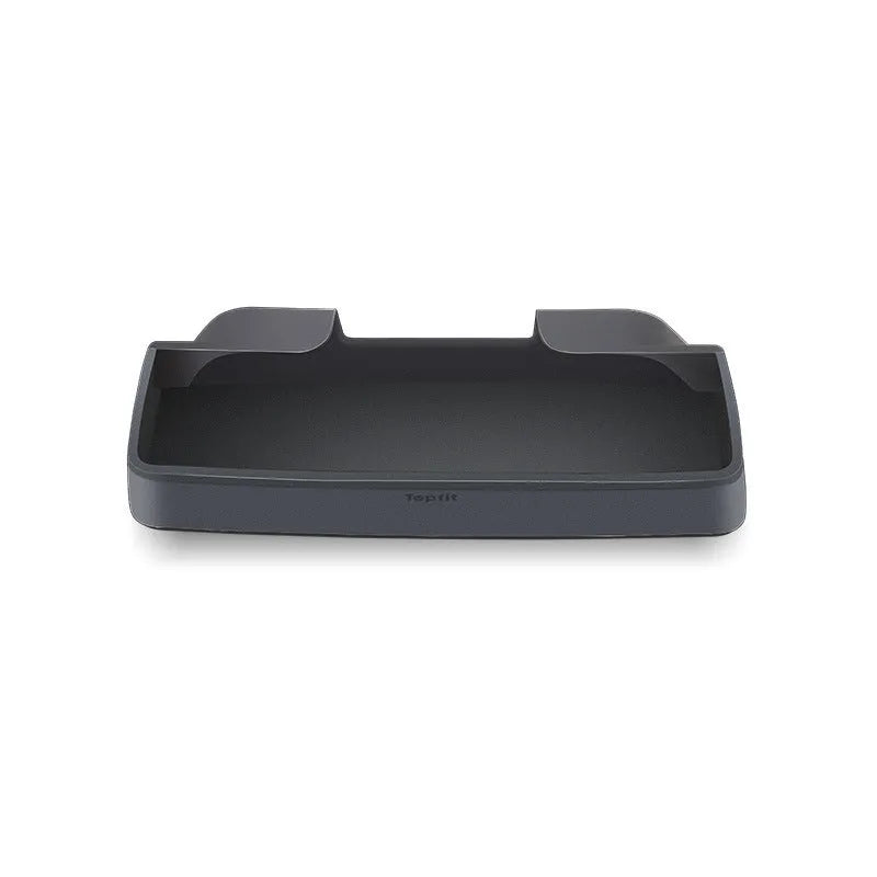 Black silicone sunglasses holder installed in Tesla centre console armrest compartment