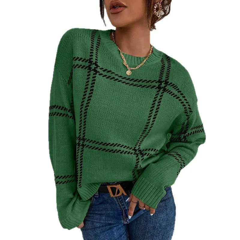 Women's loose-fit acrylic pullover sweater with a red, green, and beige plaid colour-block pattern.