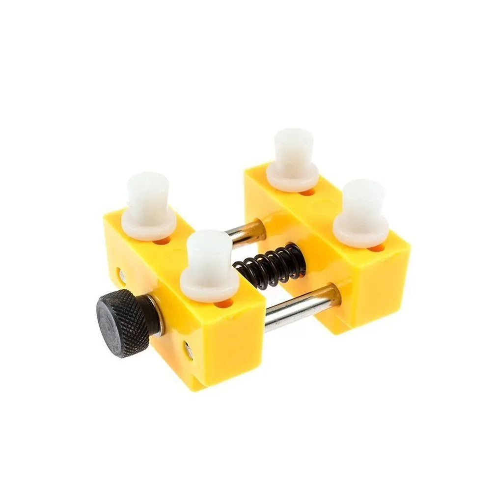 Yellow plastic watch fixing base and plastic case opener tool for watch repair.