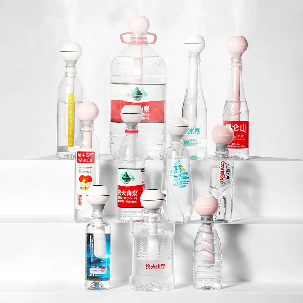 Columnar pink and white magic wand ultrasonic humidifier with USB cable and 1 litre water tank