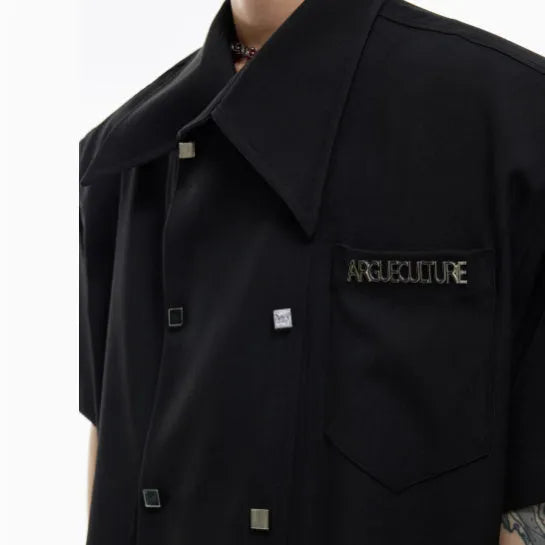 Men's loose-fitting casual short-sleeved shirt in blue with lapel collar and button detail.