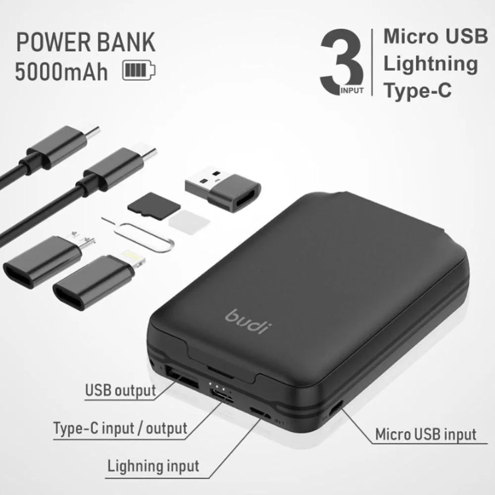 Black budi multi-functional power bank with cables and SIM kit on a table