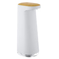 White automatic foam soap dispenser with sensor for touch-free operation on bathroom counter