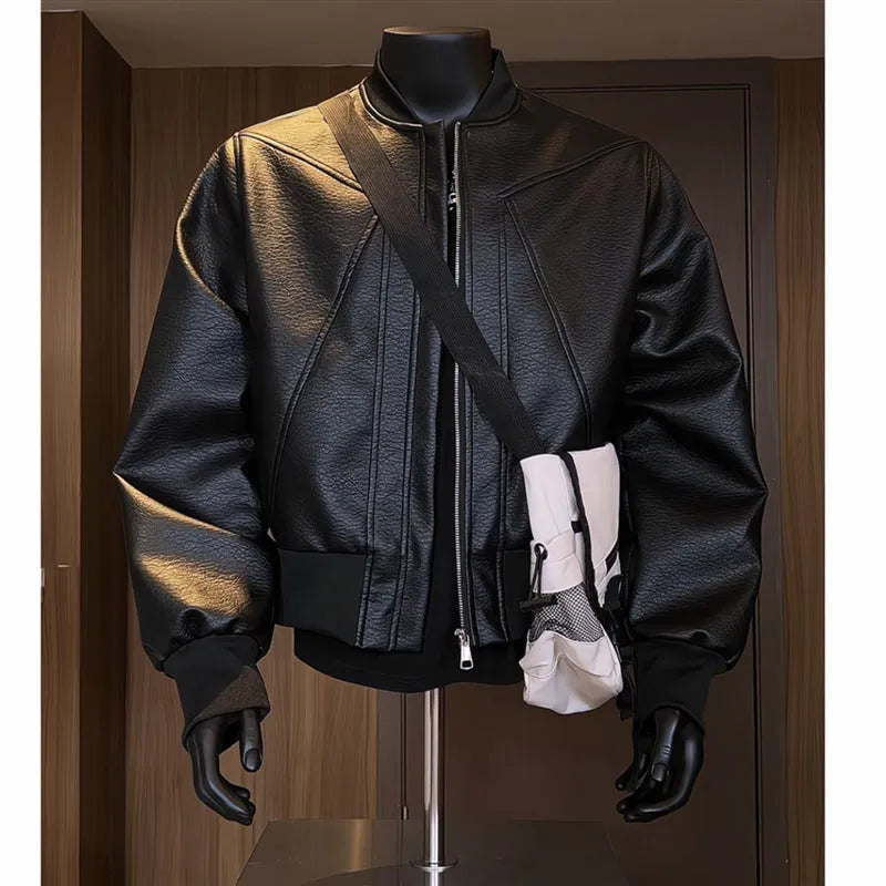 Men's long black slim-fit PU leather jacket with litchi grain texture on a hanger.