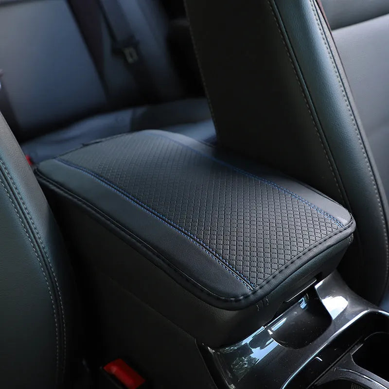 PU leather automotive armrest box cushion measuring 32x19cm in black with red cord detailing