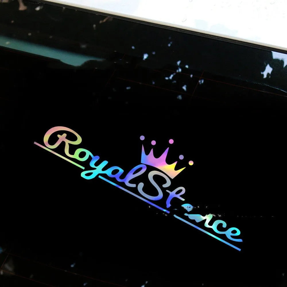 Reflective crown-shaped car sticker on vehicle windscreen showing colourful vinyl design