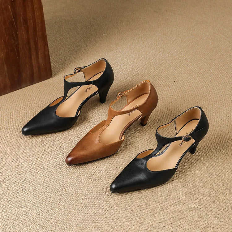 Brown retro women's T-strap sandals with a round toe, buckle closure, and a short stout heel.