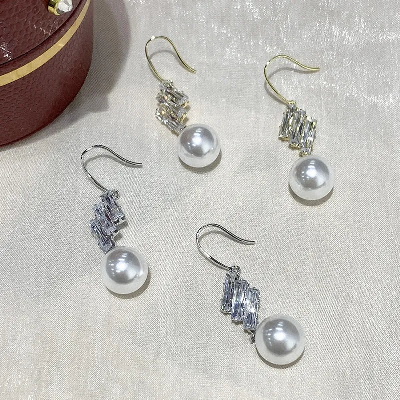 French micro inlaid diamond pearl hook earrings in gold finish