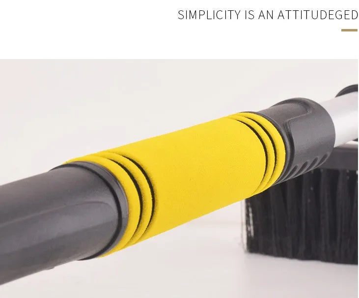 Yellow car telescopic snow shovel with aluminium handle, PVC brush and PP plastic scraper extended to 80cm on snowy windscreen