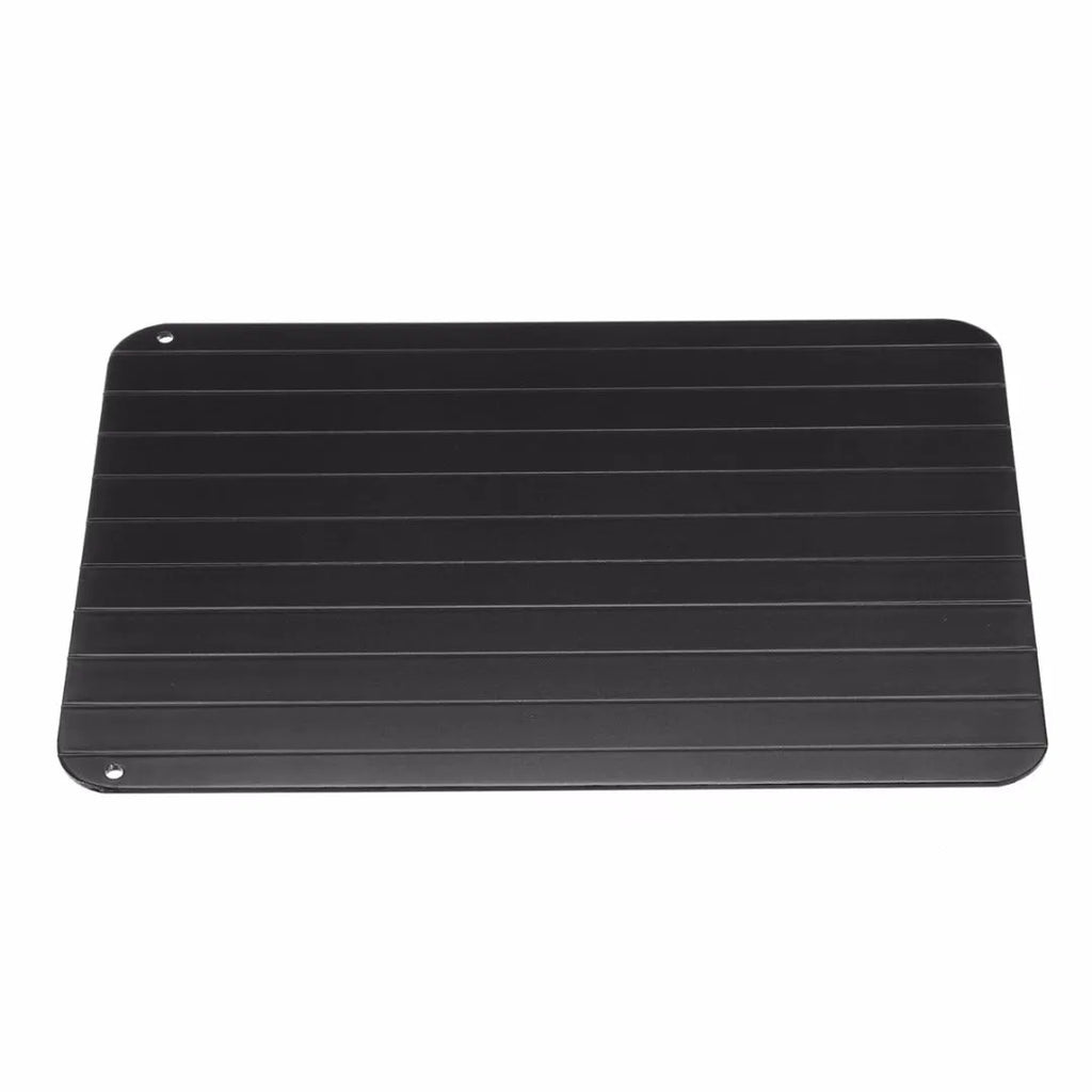 Black aluminium quick defrosting tray for thawing frozen meat and food without electricity.