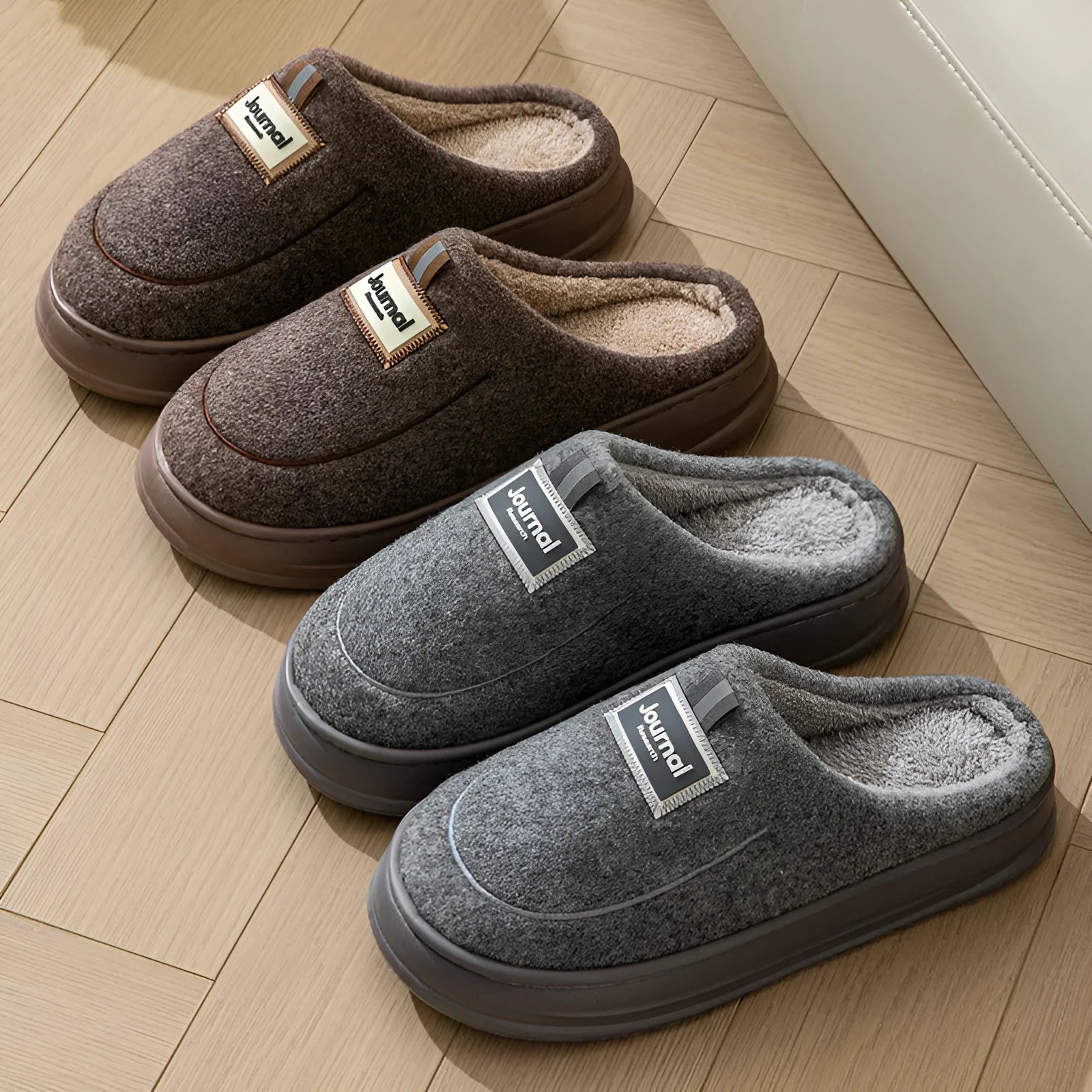 Men's grey suede slippers with a thickened sole on a wooden floor.