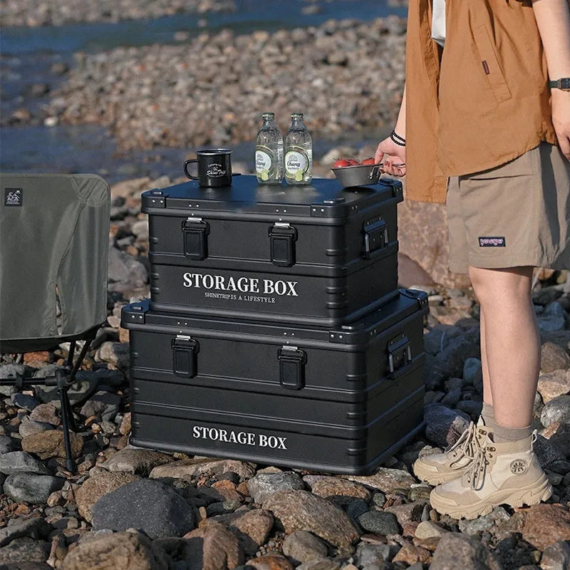 Waterproof vehicle storage box in army green colour showing sturdy handles and foldable design