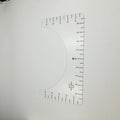 Clear acrylic sewing patch ruler for T-shirt alignment, 10 by 6 inches.