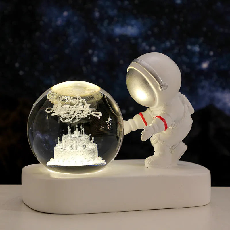 6cm crystal ball night light showing astronaut and galaxy scene inside, with USB cable