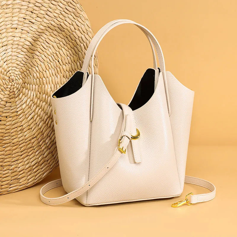 Genuine leather women's bucket bag with hand holding design in retro European American style