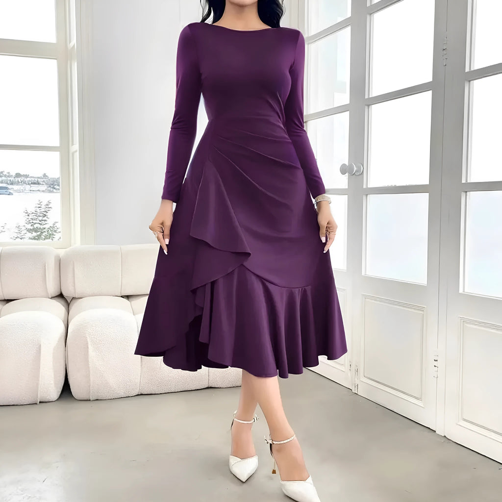 Purple women's long sleeve round neck dress with a ruffle detail on a hanger.