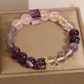 Purple natural amethyst crystal bracelet with rhinestone elements on adjustable band